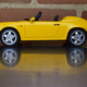 cut-down windshield and those humps in place of the rear seats scream louder to some of us than the paint does...